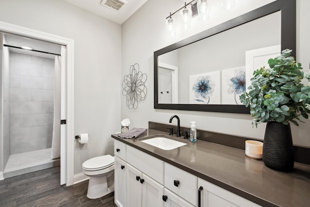 19803 Jersey Ave, Lakeville, MN 55044 - bathroom featuring vanity, wood finished floors, and a tile shower