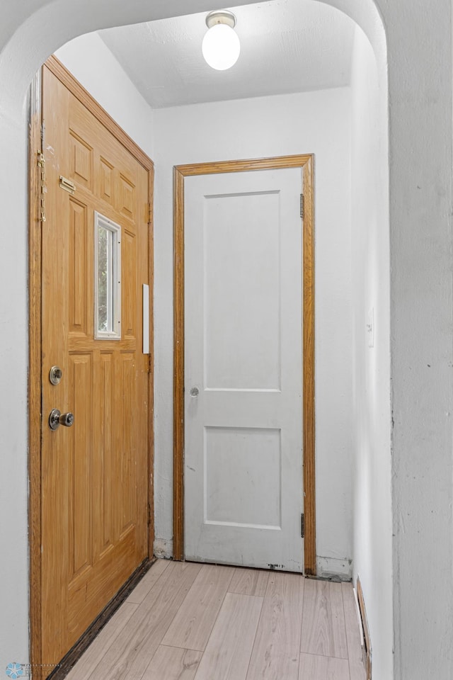 1130 Oak St N, Fargo, ND 58102 - doorway to outside featuring light wood finished floors and arched walkways