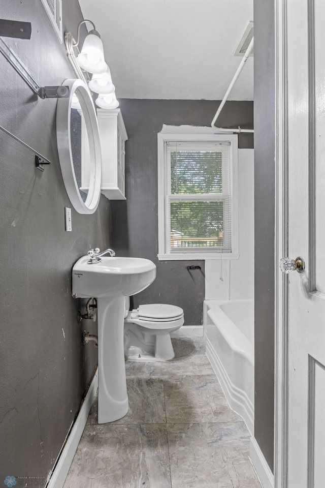 1130 Oak St N, Fargo, ND 58102 - bathroom with toilet and bathing tub / shower combination