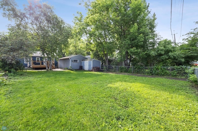 1130 Oak St N, Fargo, ND 58102 - view of yard featuring a shed and a wooden deck