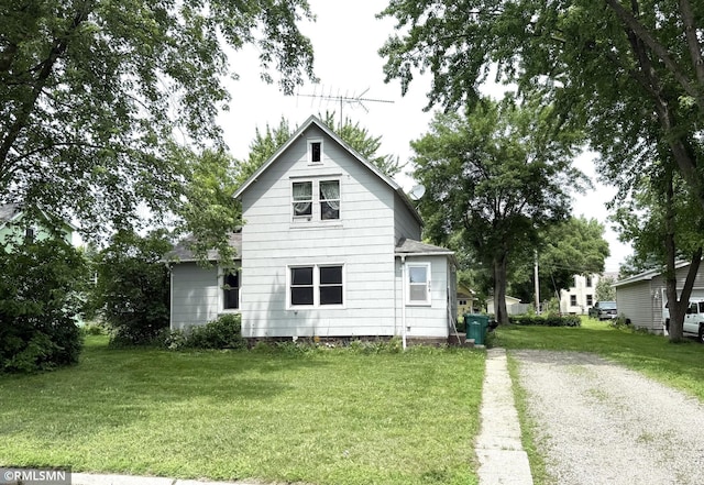 208 Cleveland St SE, Silver Lake, MN 55381 - rear view of property with a lawn