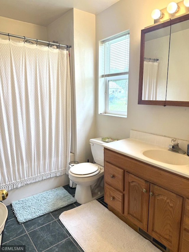 208 Cleveland St SE, Silver Lake, MN 55381 - full bath with vanity, tile patterned floors, and shower / bath combo with shower curtain