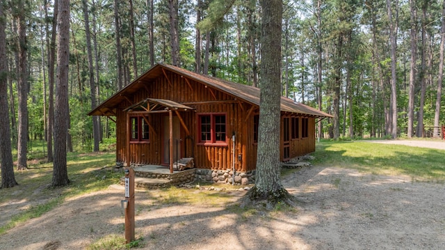 13000 Inlet Cir, Park Rapids, MN 56470 - view of front of property featuring a wooded view and board and batten siding