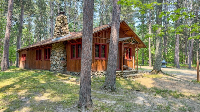 13000 Inlet Cir, Park Rapids, MN 56470 - view of side of property featuring a chimney and board and batten siding