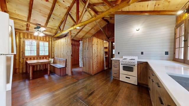 13000 Inlet Cir, Park Rapids, MN 56470 - kitchen featuring white appliances, dark wood-style flooring, wooden walls, light countertops, and a ceiling fan