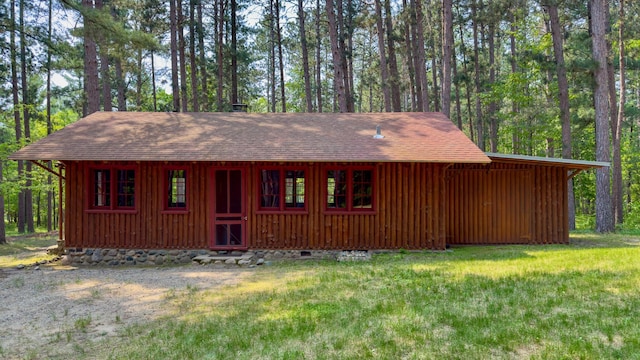 13000 Inlet Cir, Park Rapids, MN 56470 - chalet / cabin featuring a shingled roof, board and batten siding, and a front lawn