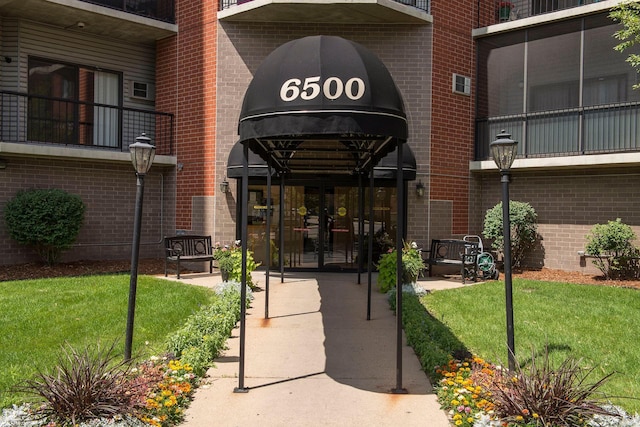6500 Woodlake Dr Unit 1006, Richfield, MN 55423 - property entrance with french doors, brick siding, and a lawn
