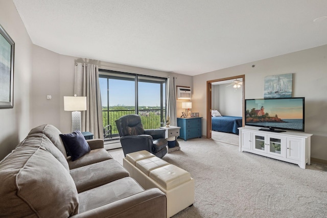 6500 Woodlake Dr Unit 1006, Richfield, MN 55423 - living room with light carpet, ceiling fan, a wall unit AC, and a baseboard radiator
