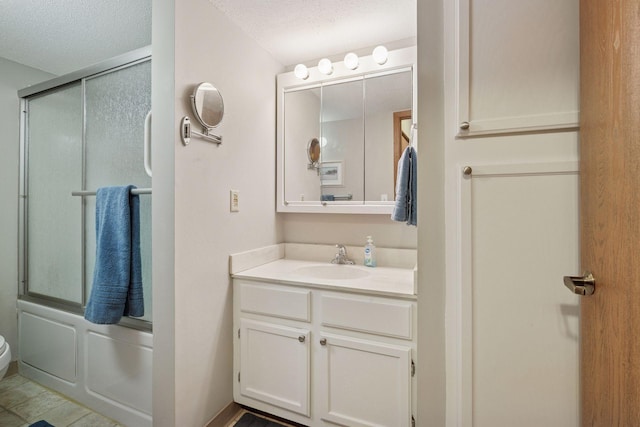 6500 Woodlake Dr Unit 1006, Richfield, MN 55423 - bathroom with vanity, a textured ceiling, and shower / bath combination with glass door