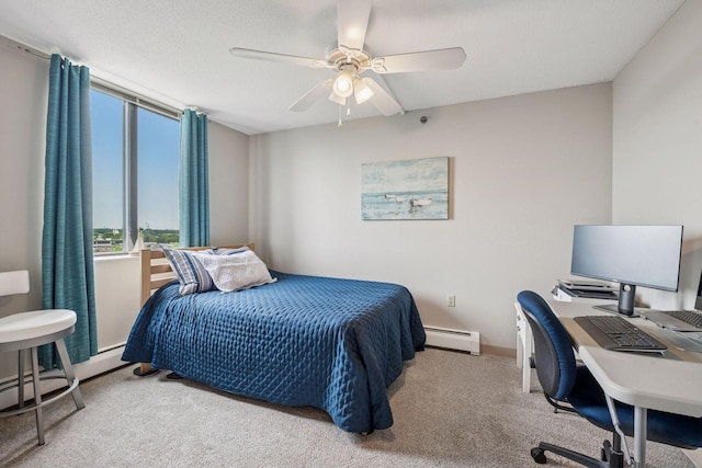 6500 Woodlake Dr Unit 1006, Richfield, MN 55423 - carpeted bedroom with a baseboard heating unit, a ceiling fan, and a desk