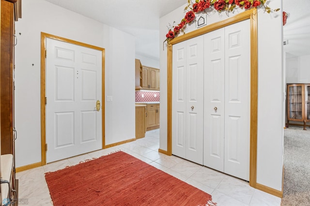2501 30th Ave S Unit 203, Fargo, ND 58103 - entryway featuring baseboards and light tile patterned floors
