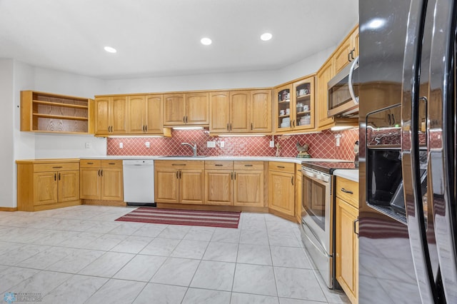 2501 30th Ave S Unit 203, Fargo, ND 58103 - kitchen with stainless steel appliances, light countertops, decorative backsplash, open shelves, and recessed lighting