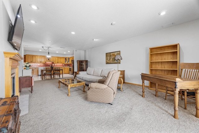 2501 30th Ave S Unit 203, Fargo, ND 58103 - living area featuring recessed lighting, light colored carpet, and a glass covered fireplace