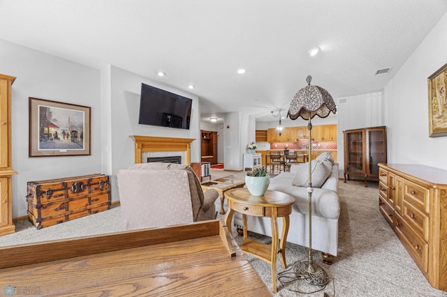 2501 30th Ave S Unit 203, Fargo, ND 58103 - living room with light colored carpet, recessed lighting, and a fireplace