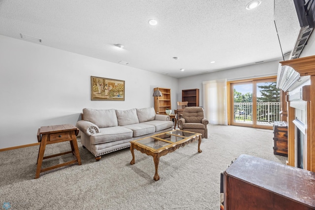 2501 30th Ave S Unit 203, Fargo, ND 58103 - living area with carpet flooring, a textured ceiling, and recessed lighting
