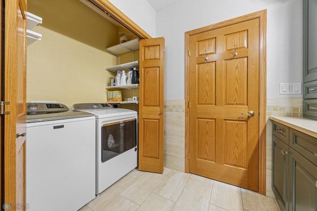 2501 30th Ave S Unit 203, Fargo, ND 58103 - laundry room with washing machine and clothes dryer and light tile patterned floors