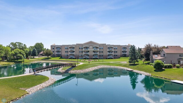 2501 30th Ave S Unit 203, Fargo, ND 58103 - view of swimming pool with a water view and a lawn