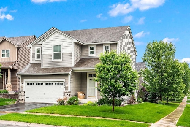 6800 Troy Ln N, Maple Grove, MN 55311 - view of front facade with a shingled roof, an attached garage, driveway, and a front lawn