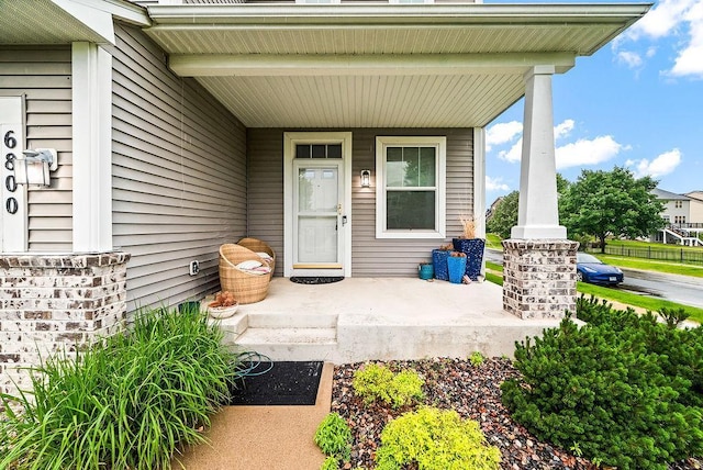 6800 Troy Ln N, Maple Grove, MN 55311 - doorway to property featuring covered porch