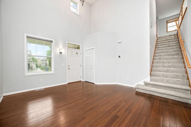 6800 Troy Ln N, Maple Grove, MN 55311 - entrance foyer featuring wood-type flooring, stairs, and a towering ceiling