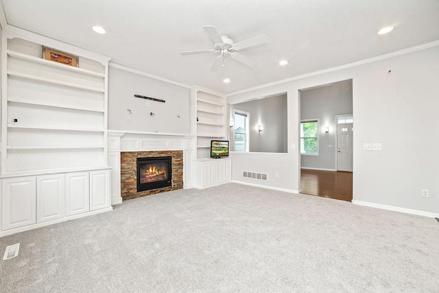 6800 Troy Ln N, Maple Grove, MN 55311 - unfurnished living room with crown molding, a stone fireplace, carpet floors, recessed lighting, and a ceiling fan