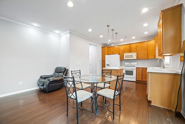 6800 Troy Ln N, Maple Grove, MN 55311 - kitchen featuring white appliances, ornamental molding, light countertops, dark wood finished floors, and recessed lighting