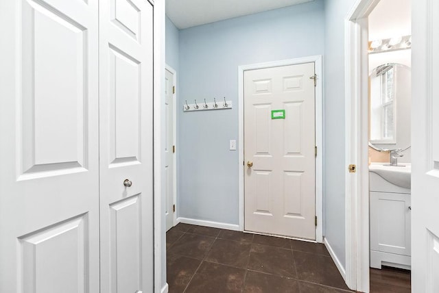6800 Troy Ln N, Maple Grove, MN 55311 - foyer featuring dark tile patterned flooring and baseboards
