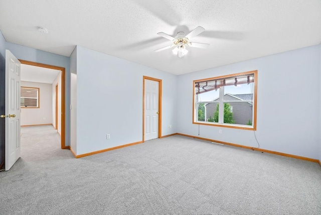 6800 Troy Ln N, Maple Grove, MN 55311 - unfurnished room featuring carpet, a ceiling fan, a textured ceiling, and a smoke detector