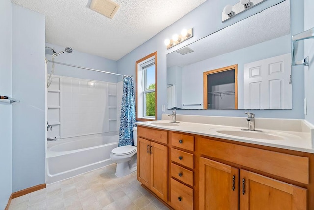 6800 Troy Ln N, Maple Grove, MN 55311 - bathroom with double vanity, shower / bath combo with shower curtain, and a textured ceiling