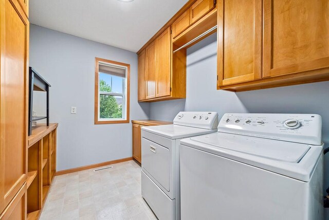 6800 Troy Ln N, Maple Grove, MN 55311 - laundry area featuring separate washer and dryer and cabinet space