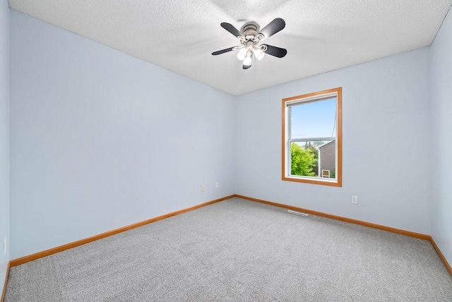 6800 Troy Ln N, Maple Grove, MN 55311 - spare room with carpet floors, a textured ceiling, and a ceiling fan