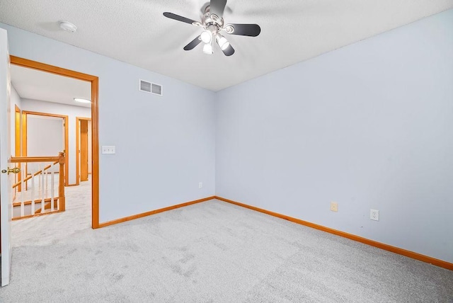 6800 Troy Ln N, Maple Grove, MN 55311 - unfurnished room with a smoke detector, carpet flooring, a ceiling fan, and a textured ceiling