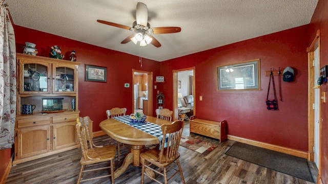 38184 County 47th Blvd, Goodhue, MN 55027 - dining space featuring dark wood-style flooring, a ceiling fan, and a textured ceiling