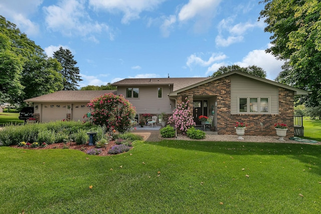 1506 Jackson Ave NE, Saint Michael, MN 55376 - split level home with a front yard, brick siding, and an attached garage