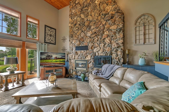 1506 Jackson Ave NE, Saint Michael, MN 55376 - carpeted living area featuring healthy amount of natural light, high vaulted ceiling, a fireplace, and wood ceiling