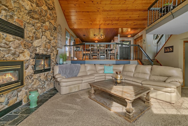 1506 Jackson Ave NE, Saint Michael, MN 55376 - living area with a stone fireplace, wooden ceiling, carpet flooring, and stairway