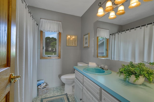 1506 Jackson Ave NE, Saint Michael, MN 55376 - full bathroom featuring tile walls, vanity, a chandelier, and tile patterned floors
