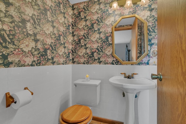 1506 Jackson Ave NE, Saint Michael, MN 55376 - half bath featuring wallpapered walls, wainscoting, and tile walls