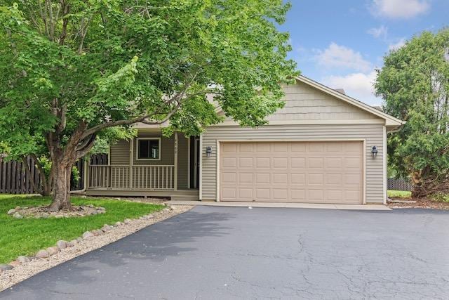 4552 131st St, Savage, MN 55378 - view of front of property with driveway, a garage, and covered porch