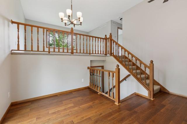 4552 131st St, Savage, MN 55378 - stairs featuring a chandelier and wood finished floors