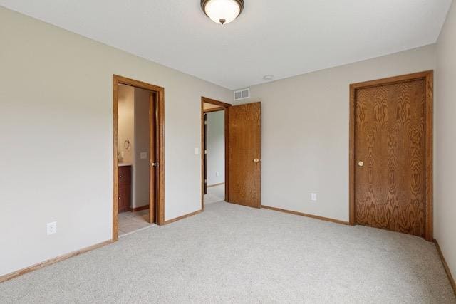 4552 131st St, Savage, MN 55378 - unfurnished bedroom with light carpet, a closet, and ensuite bathroom