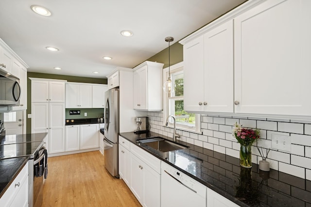 3300 88th St, Bloomington, MN 55431 - kitchen with appliances with stainless steel finishes, white cabinetry, pendant lighting, and recessed lighting