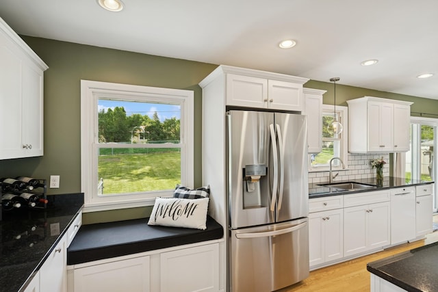 3300 88th St, Bloomington, MN 55431 - kitchen with stainless steel fridge with ice dispenser, white cabinetry, light wood-type flooring, and recessed lighting