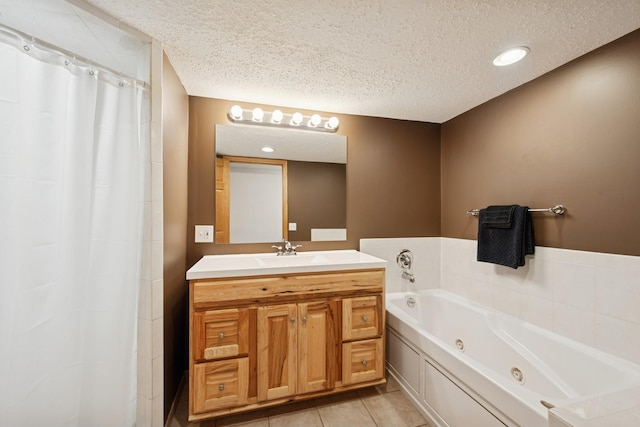3300 88th St, Bloomington, MN 55431 - bathroom featuring a textured ceiling, a whirlpool tub, vanity, tile patterned flooring, and recessed lighting