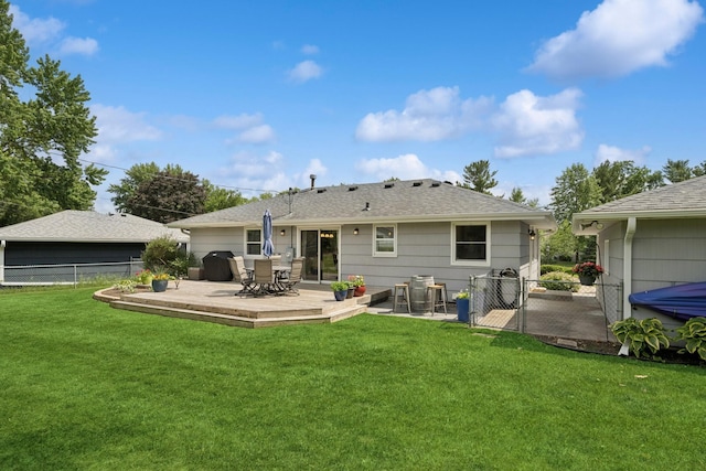 3300 88th St, Bloomington, MN 55431 - back of house with a fenced backyard, a gate, a deck, outdoor dining space, and roof with shingles