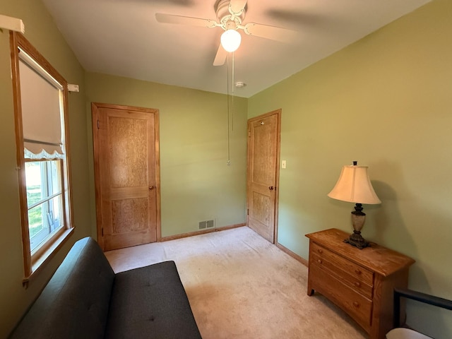 1202 4th St, Montevideo, MN 56265 - unfurnished bedroom featuring light carpet and ceiling fan