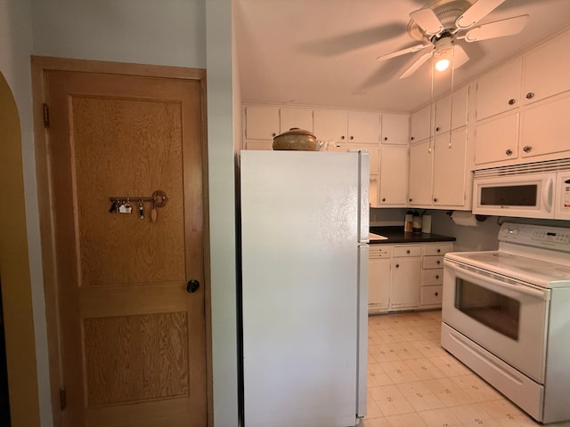1202 4th St, Montevideo, MN 56265 - kitchen with white appliances, light floors, arched walkways, white cabinets, and a ceiling fan