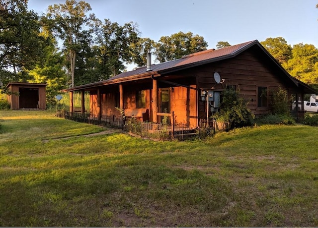 2630 320th St, Cushing, WI 54006 - view of front of property with a front lawn and a metal roof