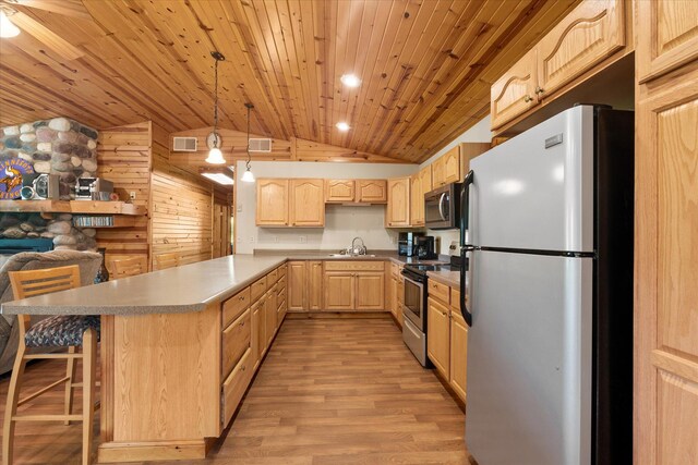 2630 320th St, Cushing, WI 54006 - kitchen with stainless steel appliances, light brown cabinets, vaulted ceiling, wood ceiling, and a peninsula