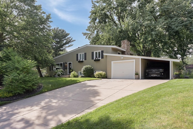 2820 Overlook Dr, Bloomington, MN 55431 - view of front of home with a front yard, a chimney, driveway, and a garage